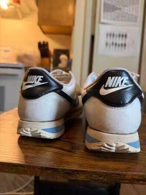 Nike Cortes in black, white and blue. Good condition just need cleaned